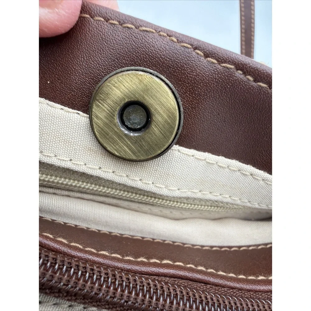 Rosetti straw tote handbag with brown faux leather trim‎ and top handles.